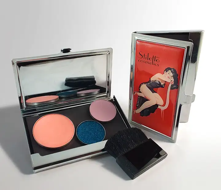 Vintage-style pin-up artwork alongside Stiletto Pin-Up product packaging